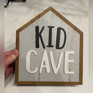 Playroom sign. “Kid cave”